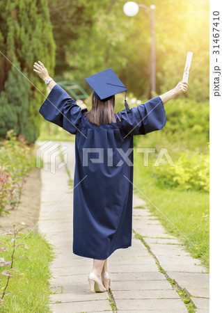 Young woman in graduation day celebrating 31467410