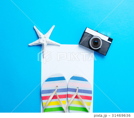 sandals, camera, starfish and sheet of paper sandals, camera, starfish and sheet of paper 31469636