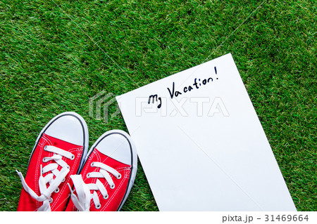 gumshoes and sheet of paper 31469664