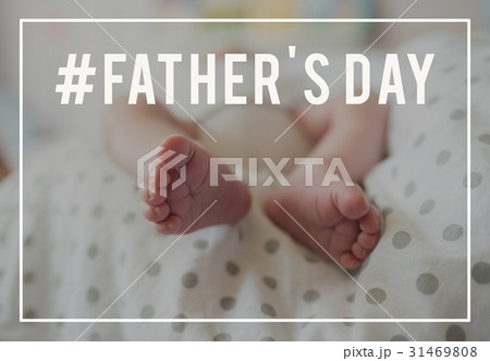 Feet of unrecognizable baby lying on bed. Fathers 31469808