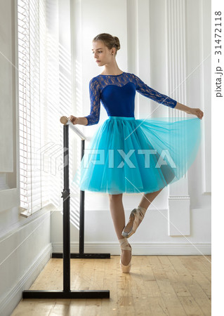 Ballerina is training on barre 31472118