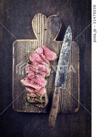 Barbecue Strip Steak on Cutting Board Barbecue Strip Steak on Cutting Board 31476036