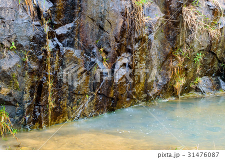 The water flows down the rocks The water flows down the rocks 31476087