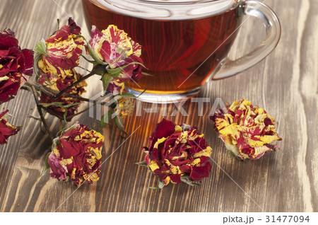 Cup of tea and dry roses Cup of tea and dry roses 31477094