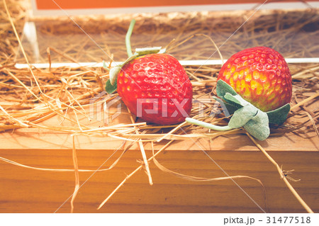Ripe red strawberries on wooden table. Ripe red strawberries on wooden table. 31477518
