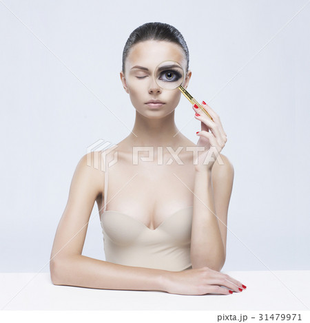 Elegant lady with magnifying glass Elegant lady with magnifying glass 31479971