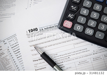US tax form 1040 with pen and calculator US tax form 1040 with pen and calculator 31481132