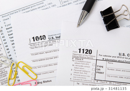 US tax form 1040, 1120 on desk 31481135