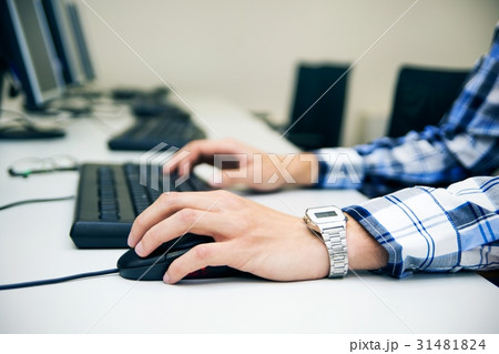 Young man typing on keyboard Young man typing on keyboard 31481824