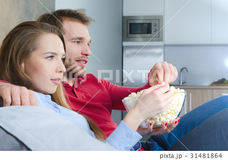 Couple enjoys free time and watching tv 31481864