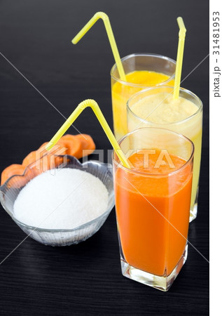 Glasses of fresh carrot, apple and orange juice Glasses of fresh carrot, apple and orange juice 31481953