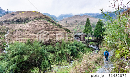 bridge over water stream between hills near Dazhai 31482075