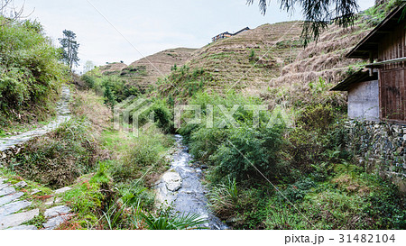 view of terraced hill and streem in Dazhai village view of terraced hill and streem in Dazhai village 31482104