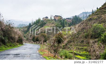 wet road and view of Dazhai village 31482277