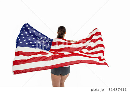 Athlete posing with american flag after victory Athlete posing with american flag after victory 31487411