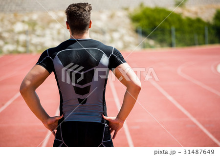 Athlete standing on running track 31487649