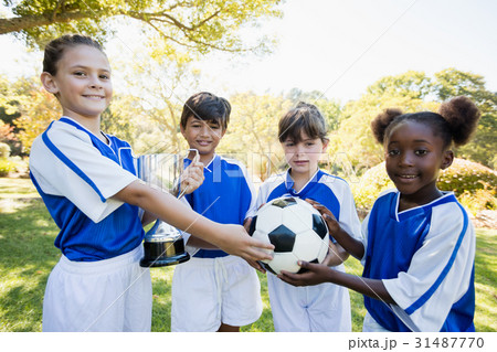 Winner kids posing together during a sunny day at camera 31487770