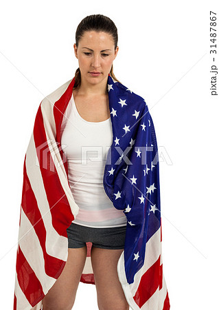 Athlete with american flag wrapped around his body 31487867