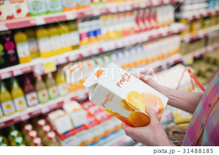Close up view of hands holding fruits juice 31488185