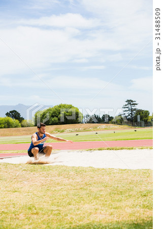 Athlete landing on sandpit 31488509