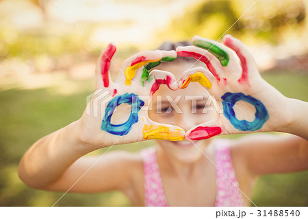 Girl making a heart with her painted arms 31488540
