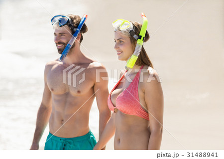 Couple standing on beach 31488941