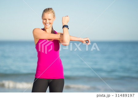 Woman exercising on beach Woman exercising on beach 31489197