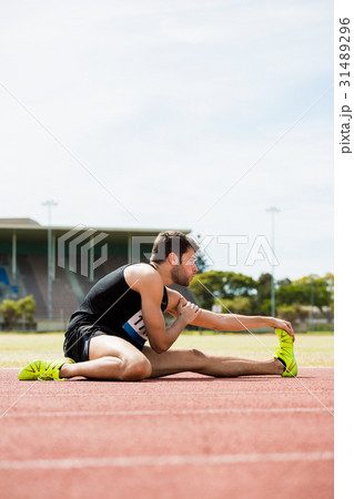 Athlete doing stretching exercise 31489296