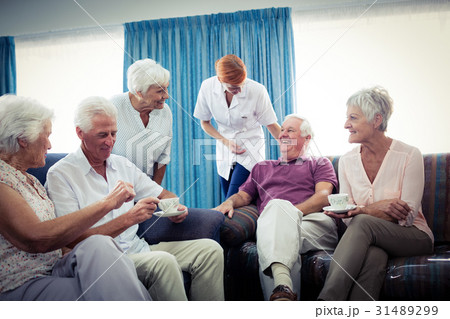 Seniors interacting with nurse 31489299