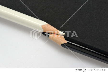 black and white crayons on the same paper background black and white crayons on the same paper background 31499544