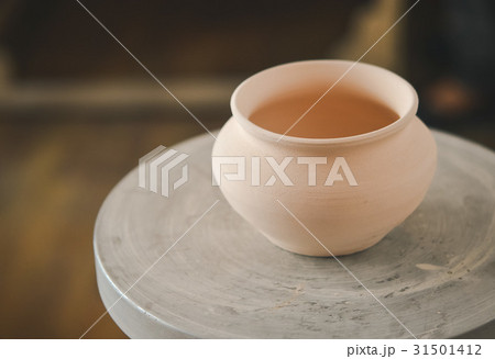 Clay pot on a potter's wheel Clay pot on a potter's wheel 31501412