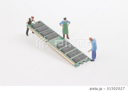 Miniature engineers with  circuit board. Miniature engineers with  circuit board. 31502027