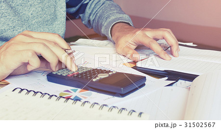 Young woman doing finance at home office 31502567