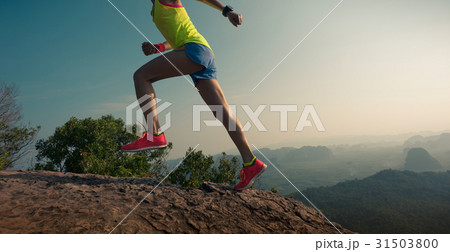 young woman trail runner running at mountain top young woman trail runner running at mountain top 31503800