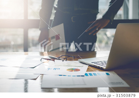 young business man standing hand holding report young business man standing hand holding report 31503879