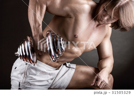 Exercising with dumbbell Exercising with dumbbell 31505329