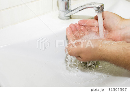 wash basin and running water from the tap in wash basin and running water from the tap in 31505597
