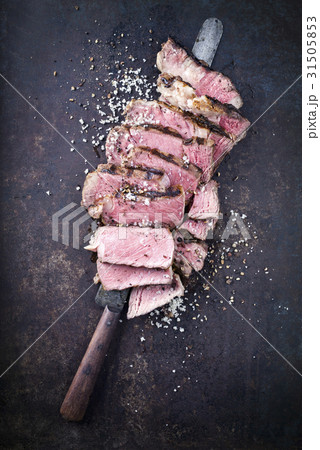 Barbecue Entrecote Steak sliced on old Metal Sheet Barbecue Entrecote Steak sliced on old Metal Sheet 31505853