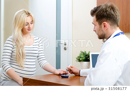 Doctor measuring of blood sugar for diabetes Doctor measuring of blood sugar for diabetes 31508177