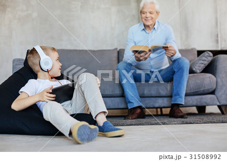 Two men of a family sharing common hobby 31508992