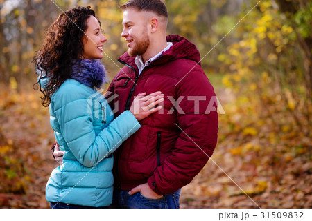 loving couple walking in the autumn forest loving couple walking in the autumn forest 31509832