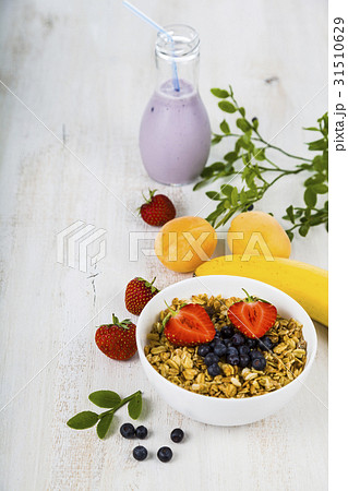Granola with strawberry and blueberries Granola with strawberry and blueberries 31510629
