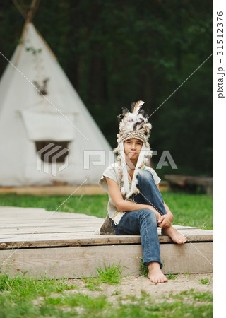 little funny boy playing native american little funny boy playing native american 31512376