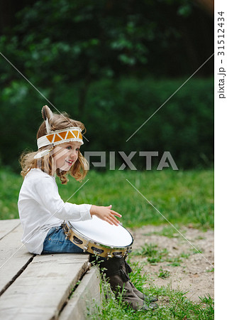 little funny girl playing native american little funny girl playing native american 31512434
