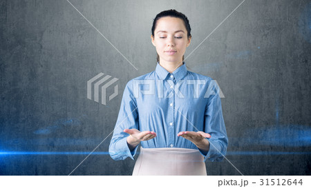 Young beautiful business woman looking down on her Young beautiful business woman looking down on her 31512644