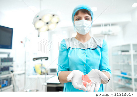Female doctor holding breast cancer awareness pink Female doctor holding breast cancer awareness pink 31513017