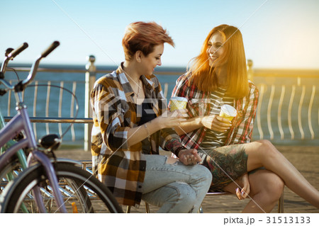Two women with bicycels 31513133