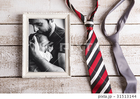Picture of father holding baby daughter. Fathers 31513144