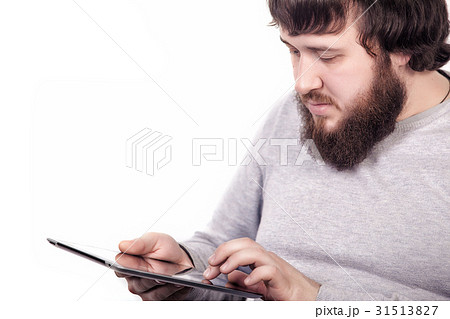 Bearded blogger typing text information for 31513827
