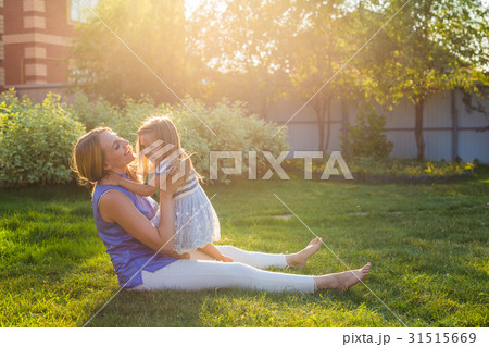 happy harmonious family outdoors. mother laughing happy harmonious family outdoors. mother laughing 31515669